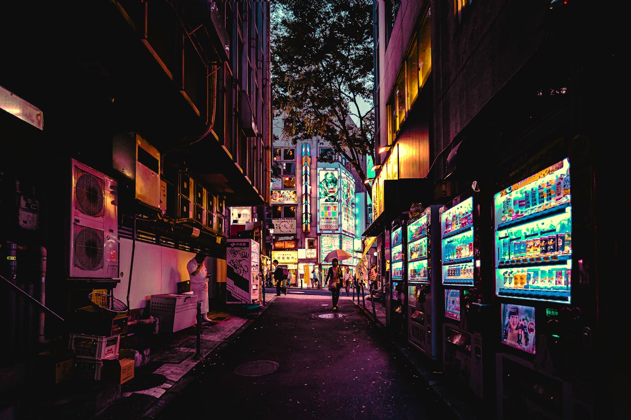 Explore a neon-lit alleyway in Tokyo, showcasing vibrant city life and bustling urban vibes.